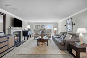 Cozy living room with Smart TV and gas fireplace. 