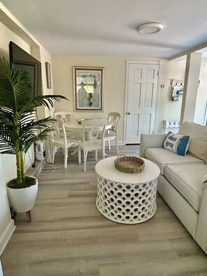 Living area - sofa bed, table and chairs, TV