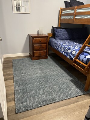 3rd bedroom - Den with closing door and twin over double bunk with smart TV