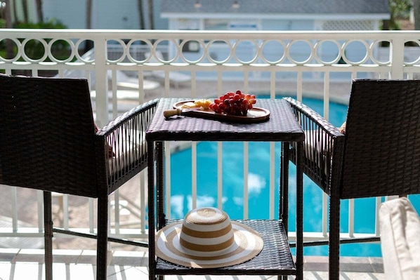 Take in the scenic pool view from your private balcony.