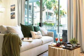 The soft green accents in SeaBottle Wishes are the perfect compliment to the swaying palms seen through the sliding glass doors.