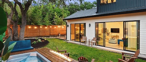 Outdoor area with pool, fire pit and enclosed yard space for privacy.
