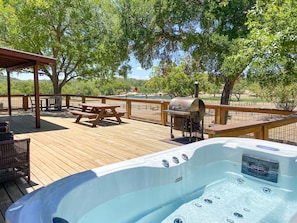 Deck with hot tub, smoker & propane grill overlooking lake