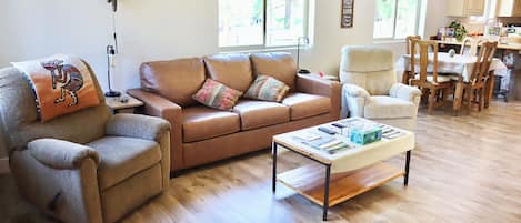 Spacious living area with smart TV and comfortable seating