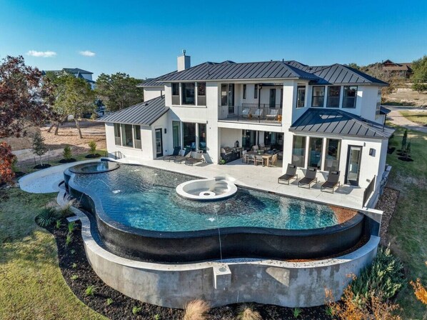 Welcome to 'Lone Star Luxe'—the epitome of Hill Country Glam, nestled on the stunning shores of Lake Travis, specifically in Devil's Cove.