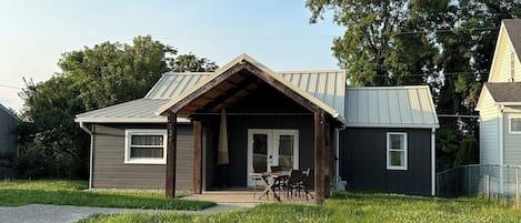 Nearly 100 year old cottage is nestled in a quiet neighborhood.