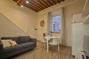 The cosy living-dining room with kitchen corner