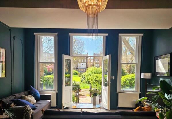 The apartment opens onto one of the largest private communal gardens in London