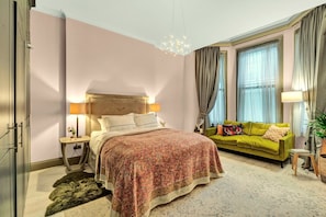 The bedroom is so large that a UK Kingsize bed and a 3 seater sofa appear tiny!