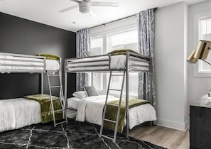 Bunk master bedroom with 4 single beds. Attached bathroom with double sink vanity