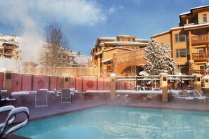 Outdoor heated pool with hot tub