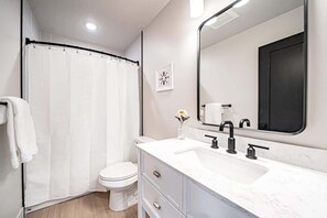 The upstairs bathroom located near the bedrooms.