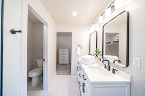Master bathroom with a large walk in closet.