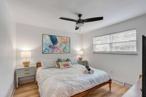 Bright and airy, with plenty of natural light you'll love snuggling up in our primary king bedroom. 