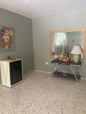 Entryway with water cooler and wine fridge.