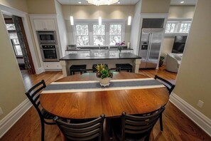 Enjoy a meal at the kitchen table and island with seating for 8