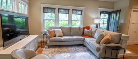 Welcome! Kick off your shoes, relax on the sectional, and watch your favorite show on TV! This sitting room opens to the kitchen and back door.