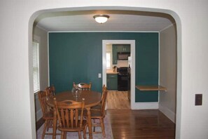 Dining room with 6 chairs and floating desk work space