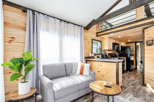 This mountain cabin themed tiny home is an escape from the ordinary.