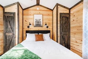 Wake up to songbirds in the luxurious queen bed with extra soft linens and pillows.