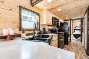 The rustic, well appointed kitchen is ready for the budding chef or cook! With full size appliances, dinnerware, cookware, bakeware plus a toaster, blender and spices to get you started, you've got what you need to make breakfast, lunch and dinner.