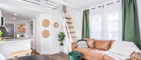 Embark on a wanderlust journey in our bespoke travel-themed tiny home. Immerse in personalized charm and compact luxury as you explore the world in style.