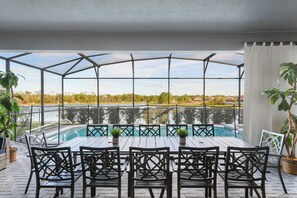 Relax by the pool with stunning lake views in this serene outdoor oasis!