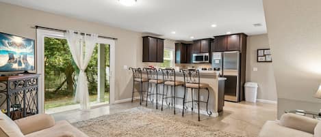 Cozy open living area with sliding doors to the back patio area