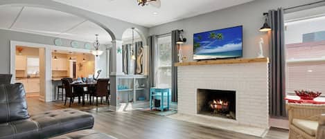 Beautifully Furnished Living Room with Leather Sectional Sofa and Smart TV