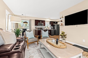 Kick back and watch your favorite shows in this inviting living room.