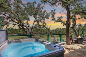 Private hot tub with views of the rear grounds.