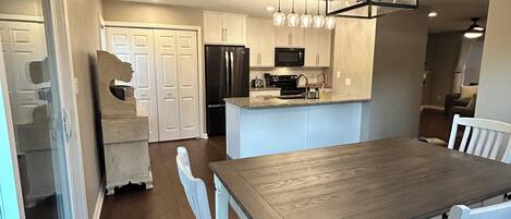 Spacious and open kitchen and dining room. Coffee hutch
