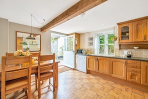 The open-plan kitchen and dining area with plenty of space for meal preparation
