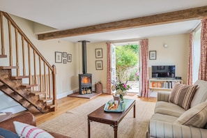 Relax in the cosy sitting room complete with wood burning stove