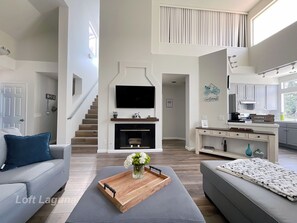 Bright & Airy Living Room - Relax on sectional sofa & bask in natural light.