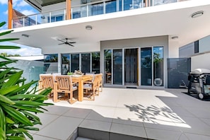 Dine alfresco beside the pool making the most of the outdoor table and BBQ.
