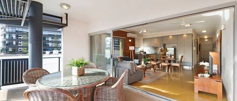 Large sliding glass doors let in natural light and open up onto a furnished balcony where you can relax and enjoy 