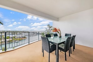 Enjoy a huge downstairs furnished balcony with al fresco seating and a side of sparkling marina views.
