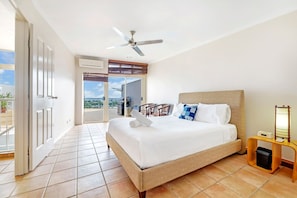 A huge, bright and breezy master bedroom has a queen bed, an en-suite bathroom and direct access to the beautiful rooftop deck.
