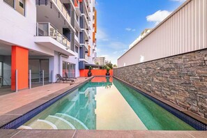 Spend those warm summer days cooling off in the stunning shared pool that is framed by a feature wall and offers loads of privacy