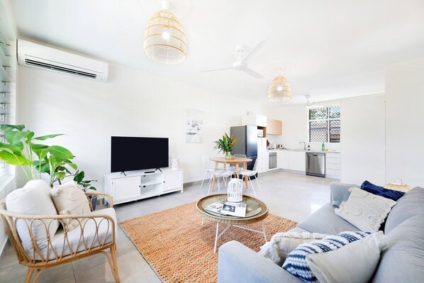  A bright and airy open-plan layout creates a welcoming space to unwind, with air-conditioning throughout ensuring year-round comfort. 
