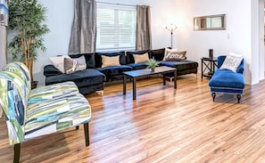 Living Room with L-sofa, long chaise and 2 accent chairs.