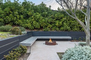 Outdoor bench by the firepit