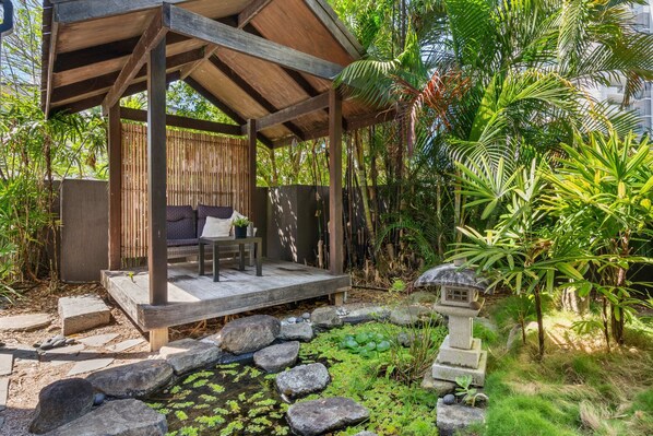 Make the most of the Japanese-inspired garden, shaded alfresco area, a picturesque pond.