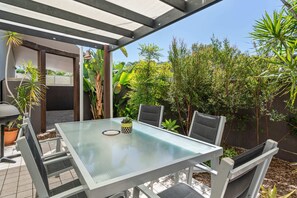 Enjoy a meal with family and friends on the outside dining table.