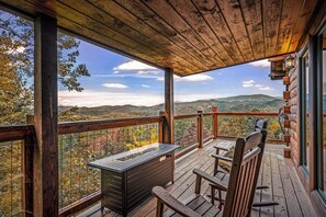 Warm up by the fire as you watch the sun rise over downtown Pigeon Forge and Mt. Leconte!