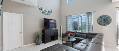 Gorgeous Downstairs Living Area with Comfortable Seating and Flat Screen TV