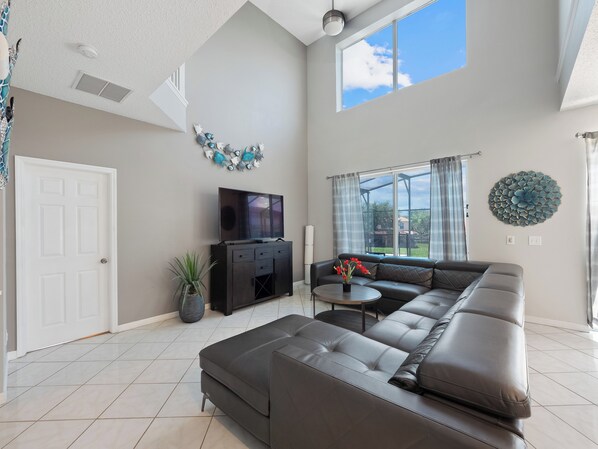 Gorgeous Downstairs Living Area with Comfortable Seating and Flat Screen TV