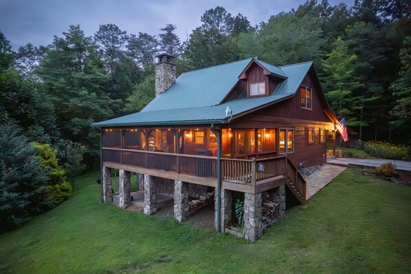 Sylvan Lea Cabin at sunset. Sits atop a knoll.