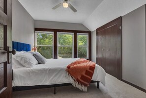 Master bedroom with queen bed and small desk to work from home